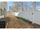 Beautiful backyard features stepping stones and a white fence with garden accents at 2130 Birkdale St, Villa Rica, GA 30180