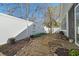 Nice backyard features stepping stones, white fence, and access to screened porch at 2130 Birkdale St, Villa Rica, GA 30180