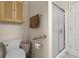 Bright bathroom featuring a shower, toilet, linen storage and towel rack at 2130 Birkdale St, Villa Rica, GA 30180