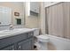 Bathroom featuring a vanity with a white countertop, gray cabinets and a shower-tub combination at 2130 Birkdale St, Villa Rica, GA 30180