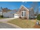 Attractive home with stone accents, a two-car garage, and a landscaped yard at 2130 Birkdale St, Villa Rica, GA 30180