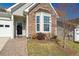 Lovely home featuring stone accents, a well-manicured lawn, and a charming entrance at 2130 Birkdale St, Villa Rica, GA 30180