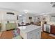 Bright eat-in kitchen with white cabinets, stainless steel appliances, and a dining table set by the window at 2130 Birkdale St, Villa Rica, GA 30180