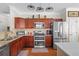 Updated kitchen featuring stainless steel appliances, granite countertops, and ample cabinet space at 2130 Birkdale St, Villa Rica, GA 30180