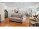 Spacious living room with hardwood floors, open layout, and seamless kitchen integration at 2130 Birkdale St, Villa Rica, GA 30180