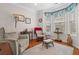 Cozy sitting area featuring bay windows, plush seating, and hardwood floors at 2130 Birkdale St, Villa Rica, GA 30180