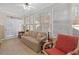 Inviting sunroom featuring neutral furniture, lots of natural light and a tile floor at 2130 Birkdale St, Villa Rica, GA 30180