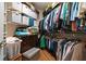 Organized walk-in closet featuring shelving and hanging space for clothing and accessories at 2130 Birkdale St, Villa Rica, GA 30180