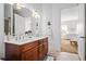 Bathroom featuring a double sink vanity and adjacent bedroom at 326 Roswell Se St # 706, Marietta, GA 30060