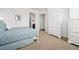 Comfortable bedroom with white furniture and soft carpet, a peaceful and inviting retreat at 326 Roswell Se St # 706, Marietta, GA 30060
