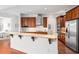Well-lit kitchen with stainless appliances, granite countertops, and an open view of the adjacent bedroom at 326 Roswell Se St # 706, Marietta, GA 30060