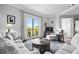 Bright living room featuring plush seating, a cozy rug, and a sliding glass door to a private balcony at 326 Roswell Se St # 706, Marietta, GA 30060