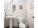 Classic powder room featuring pedestal sink and oval mirror at 326 Roswell Se St # 706, Marietta, GA 30060