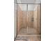 Tile shower with glass surround, neutral colors and tiled walls in bathroom at 326 Roswell Se St # 706, Marietta, GA 30060