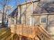 New wooden deck with railings, accessible from the house for relaxation at 9061 Greenwood Way, Canton, GA 30115