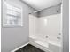Bathroom with shower-tub combination and tiled floor at 9061 Greenwood Way, Canton, GA 30115