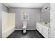 Full bathroom featuring a combination tub and shower, tile floors, and granite countertops at 9061 Greenwood Way, Canton, GA 30115