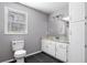 Bathroom featuring tiled floors, granite countertops, and built-in storage at 9061 Greenwood Way, Canton, GA 30115