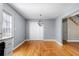 Dining area featuring hardwood floors, modern lighting and large closet at 9061 Greenwood Way, Canton, GA 30115