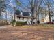 Home featuring a covered front porch, offering a warm and inviting welcome at 9061 Greenwood Way, Canton, GA 30115
