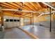 Spacious garage with exposed ceiling and multiple garage doors at 9061 Greenwood Way, Canton, GA 30115