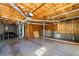 Spacious garage featuring exposed wood ceiling and concrete flooring at 9061 Greenwood Way, Canton, GA 30115