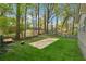 Backyard featuring lawn, perimeter fence, and mature trees at 2115 Randolph Nw Cir, Kennesaw, GA 30144