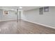 Spacious basement with wood-look flooring, natural light, and exterior access at 2115 Randolph Nw Cir, Kennesaw, GA 30144
