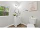 Charming bathroom with a modern vanity, stylish mirror, and updated fixtures at 2115 Randolph Nw Cir, Kennesaw, GA 30144