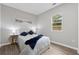 Cozy bedroom with natural light, stylish decor, and wood-look flooring at 2115 Randolph Nw Cir, Kennesaw, GA 30144