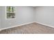 Empty bedroom with wood-look floors and a window with a view at 2115 Randolph Nw Cir, Kennesaw, GA 30144