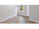 Well-lit bedroom featuring wood-look floors and a window with a view at 2115 Randolph Nw Cir, Kennesaw, GA 30144