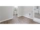 Hallway with an entry to a bathroom and kitchen, offering modern fixtures and design at 2115 Randolph Nw Cir, Kennesaw, GA 30144