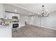 Spacious kitchen featuring stainless steel appliances, white cabinets, stylish hardware, and sleek countertops at 2115 Randolph Nw Cir, Kennesaw, GA 30144