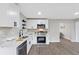 Updated kitchen featuring stainless appliances, white cabinetry, modern hardware, and attractive countertops at 2115 Randolph Nw Cir, Kennesaw, GA 30144