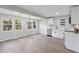 Bright kitchen with stainless steel appliances, white cabinets, spacious dining area, and wood-look flooring at 2115 Randolph Nw Cir, Kennesaw, GA 30144