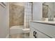 Bathroom with a tiled shower-tub combo, neutral walls, and a modern vanity at 516 Cunninghame Ct, Peachtree City, GA 30269