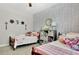 Shared bedroom featuring twin beds and storage unit with books and toys at 516 Cunninghame Ct, Peachtree City, GA 30269