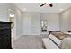 Spacious bedroom featuring an ensuite bathroom entrance and walk-in closet at 516 Cunninghame Ct, Peachtree City, GA 30269