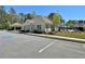 Community clubhouse featuring convenient parking and well-maintained landscaping at 516 Cunninghame Ct, Peachtree City, GA 30269