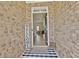 Welcoming entryway with a view of the living room featuring hardwood floors and neutral décor at 516 Cunninghame Ct, Peachtree City, GA 30269