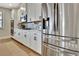 Bright kitchen with stainless steel refrigerator and modern appliances at 516 Cunninghame Ct, Peachtree City, GA 30269