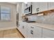 Contemporary kitchen with a gas range, oven, and clean, white cabinets at 516 Cunninghame Ct, Peachtree City, GA 30269