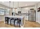 Stylish kitchen with white cabinets, stainless steel appliances, and a large island at 516 Cunninghame Ct, Peachtree City, GA 30269