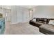 Open bonus room featuring a sofa, built in cabinets, and storage at 516 Cunninghame Ct, Peachtree City, GA 30269