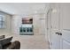 Spacious bonus room with a TV, cabinet, and multiple closets/doors at 516 Cunninghame Ct, Peachtree City, GA 30269