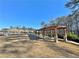 Community view showcasing a pergola with seating, and lush landscaping creating a serene environment at 516 Cunninghame Ct, Peachtree City, GA 30269