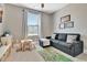 Charming playroom featuring a cozy couch, play table, and plenty of space for activities at 516 Cunninghame Ct, Peachtree City, GA 30269