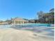 Community pool with lounge chairs, picnic tables and a clubhouse at 516 Cunninghame Ct, Peachtree City, GA 30269