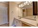 Bathroom featuring a large vanity, ample storage, and a separate tub and shower at 1749 Coleville Oak Ln, Lawrenceville, GA 30046